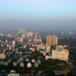 an aerial view of a city with tall buildings